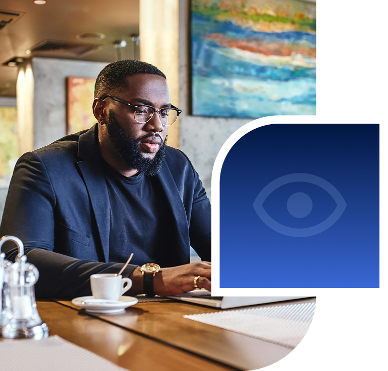 Man at coffee shop on laptop